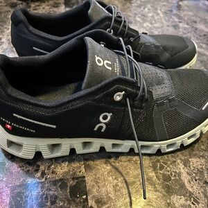 Women’s size 9 black & white on running shoes